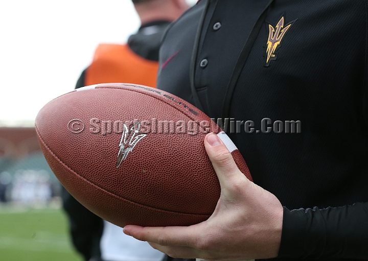 122912 Kraft SA-017.JPG - Dec 29, 2012; San Francisco, CA, USA; An Arizona State Sun Devil's assistant prepares a fresh ball against the Navy Midshipmen in the 2012 Kraft Fighting Hunger Bowl at AT&T Park.